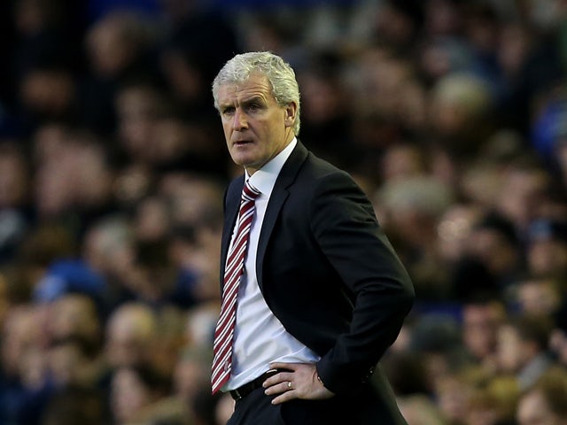 Manager of Stoke City Mark Hughes looks on during the Barclays Premier League match between Everton and Stoke City at Goodison Park on November 30, 2013