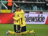 Lazio's Felipe Anderson is congratulated by teammate Brayan Perea after scoring his team's second goal during their Europa League group match on November 28, 2013