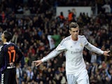 Real Madrid's Welsh striker Gareth Bale celebrates after scoring a goal during the Spanish league football match against Real Valladolid CF on November 30, 2013