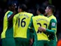 Gary Hooper of Norwich is congratulated by teammates after scoring the opening goal during the Barclays Premier league match between Norwich City and Crystal Palace on November 30, 2013
