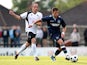 George Moncur of West Ham controls the ball from Elliot Buchanan of Boreham Wood during a Pre-Season Friendly match between Boreham Wood FC and West Ham United at Meadow Park on July 10, 2012