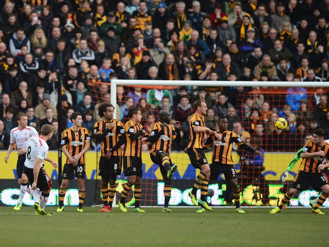 Steven Gerrard of Liverpool scores with a free kick during the Barclays Premier League match between Hull City and Liverpool at KC Stadium on December 1, 2013