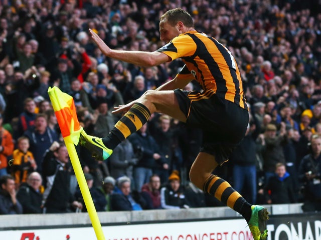 David Meyler of Hull City celebrates scoring his team's second goal during the Barclays Premier League match between Hull City and Liverpool at KC Stadium on December 1, 2013