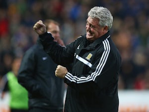 Steve Bruce, manager of Hull City celebrates his team's third goal during the Barclays Premier League match between Hull City and Liverpool at KC Stadium on December 1, 2013