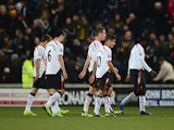 Liverpool players walk off after their 3-1 defeat during the Barclays Premier League match between Hull City and Liverpool at KC Stadium on December 1, 2013