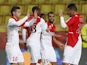 Monaco's James Rodriguez celebrates with Emmanuel Riviere and team mates after scoring a goal during a French L1 football match against Rennes on November 30, 2013