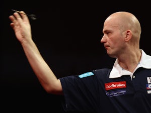 Jamie Caven of Great Britain in action in his first round match against Roland Scholten of the Netherlands during day one of the 2012 Ladbrokes.com World Darts Championship at Alexandra Palace on December 15, 2011