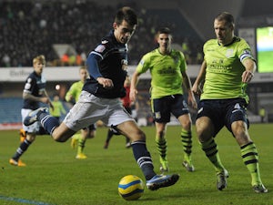 Millwall's English striker John Marquis shoots at goal during the English FA Cup fourth round football match between Millwall and Aston Villa at The Den in south-east London on January 25, 2013