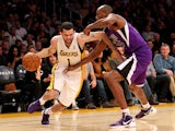 Jordan Farmar #1 of the Los Angeles Lakers drives against Travis Outlaw #25 of the Sacramento Kings at Staples Center on November 24, 2013