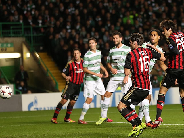 AC Milan's Brazilian forward Kaka (R) scores the opening goal during at the UEFA Champions League group H football match between Celtic and AC Milan at Celtic Park in Glasgow on November 26, 2013