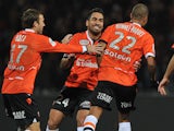 Lorient's players celebrate after Lorient's French forward Kevin Monnet-Paquet scored during the French L1 football match Lorient against Nice on November 30, 2013