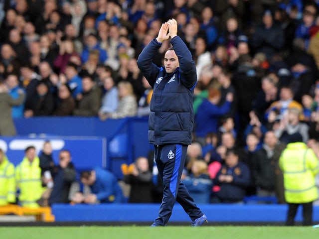 Everton's US midfielder Landon Donovan waves to the crowd as his loan spell comes to an end after the English FA Cup 5th Round football match between Everton and Blackpool at Goodison Park in Liverpool, north-west England on February 18, 2012