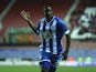 Wigan's Leon Barnett celebrates after scoring the opening goal against Zulte Waregem during their Europa League group match on November 28, 2013