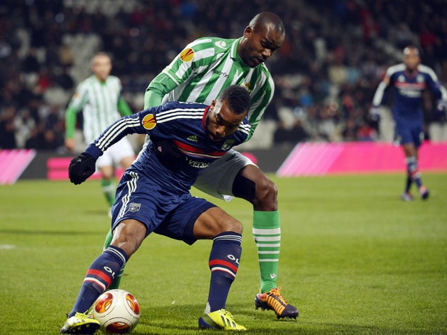 Real Betis Brazilian defender Paulao vies with Lyon's French forward Jimmy Briand during the Europa League football match Olympique Lyonnais vs Real Betis on November 28, 2013