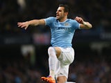 Alvaro Negredo of Manchester City celebrates scoring the opening goal during the Barclays Premier League match between Manchester City and Swansea City at Etihad Stadium on December 1, 2013