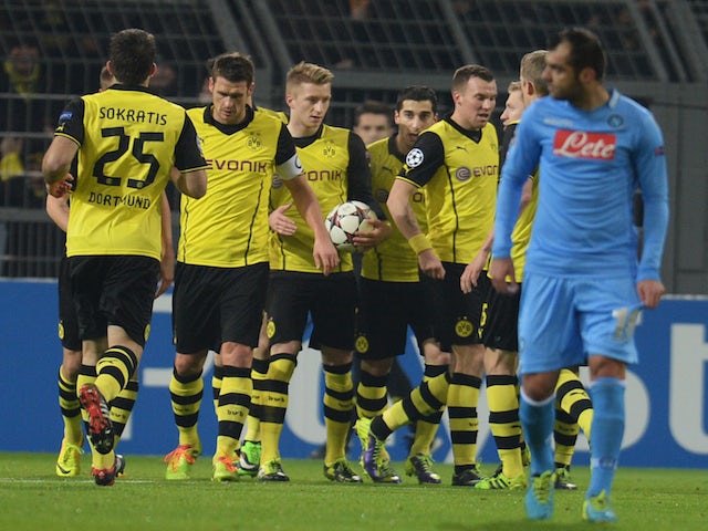 Dortmund's striker Marco Reus celebrates scoring with his teammates during the UEFA Champions League Group F football match against Napoli on November 26, 2013