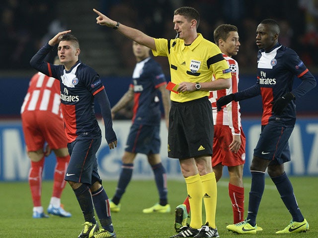 Paris Saint-Germain's Marco Verratti is sent off against Olympiakos during their Champions League group match on November 27, 2013
