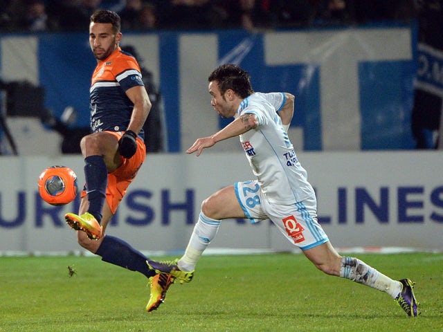 Montpellier's Moroccan defender Abdelhamid El-Kaoutari vies with Marseille's French midfielder Mathieu Valbuena on November 29, 2013