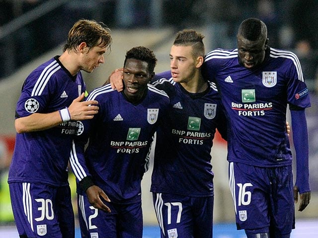 Anderlecht's Massimo Bruno celebrates with teammates after scoring his team's second goal against Benfica during their Champions League group match on November 27, 2013