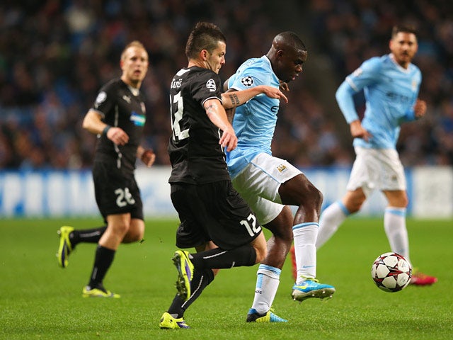 Viktoria Plzen's Michal Duris and Man City's Micah Richards battle for the ball during their Champions League group match on November 27, 2013