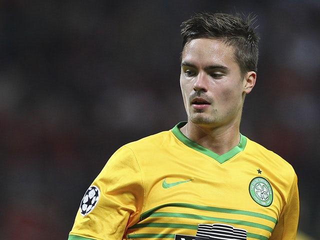 Mikael Lustig of Celtic looks on during the UEFA Champions League group H match between AC Milan and Celtic at Stadio Giuseppe Meazza on September 18, 2013