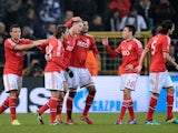 Benfica's Nemanja Matic is congratulated by teammates after scoring his team's opening goal against Anderlecht during their Champions League group match on November 27, 2013