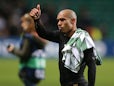 AC Milan's Dutch midfielder Nigel de Jong celebrates at full time during the UEFA Champions League group H football match between Celtic and AC Milan at Celtic Park in Glasgow on November 26, 2013
