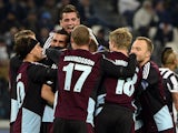 Copenhagen's Olof Mellberg is congratulated by teammates after scoring his team's opening goal against Juventus during their Champions League group match on November 27, 2013