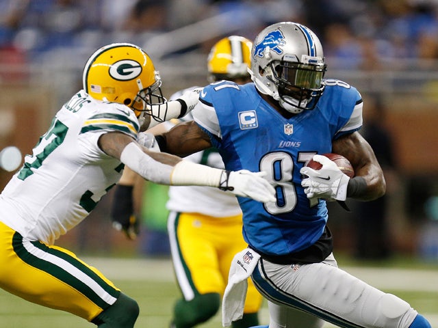 Calvin Johnson #81 of the Detroit Lions tries to get around the tackle of Sam Shields #37 of the Green Bay Packers during the first quarter at Ford Field on November 28, 2013