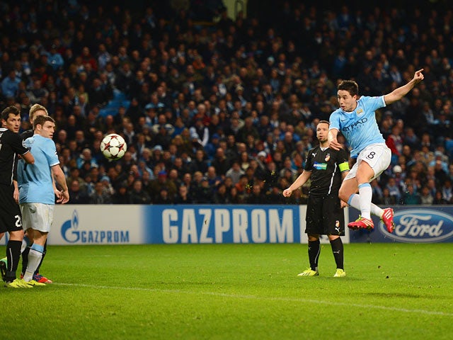 Man City's Samir Nasri scores his team's second goal against Viktoria Plzen during their Champions League group match on November 27, 2013