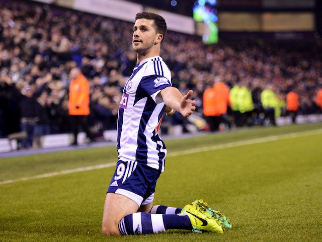 Shane Long of West Bromwich Albion celebrates as he scores their second goal during the Barclays Premier League match against Aston Villa on November 25, 2013