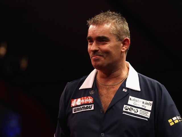 Steve Beaton of Great Britain reacts to winning his first round match against Magnus Caris of Sweden during day three of the 2012 Ladbrokes.com World Championship at Alexandra on December