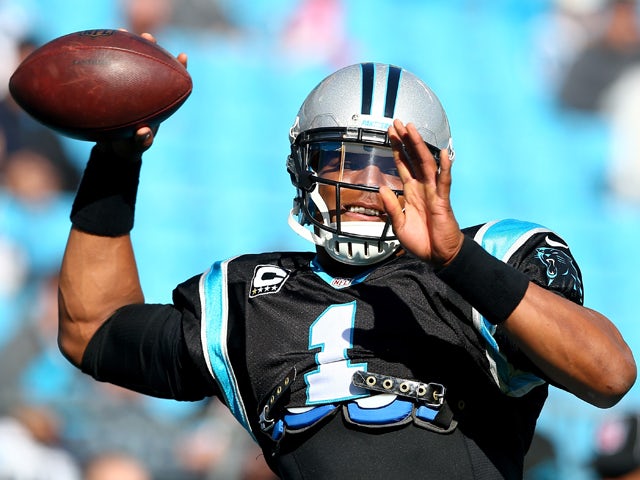 Cam Newton #1 of the Carolina Panthers warms up before their game against the Tampa Bay Buccaneers at Bank of America Stadium on December 1, 2013