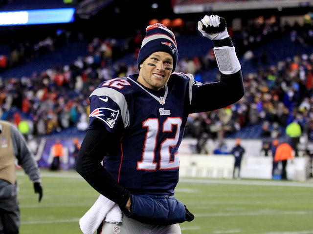 Quarterback Tom Brady of the New England Patriots walks off the field after a game at Gillette Stadium on November 24, 2013 
