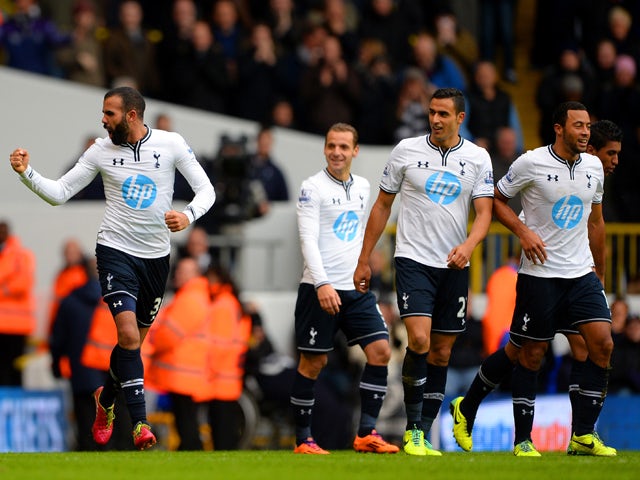Sandro of Tottenham Hotspur looks towards the bench as he celebrates scoring their second goal during the Barclays Premier League Match between Tottenham Hotspur and Manchester United at White Hart Lane on December 1, 2013
