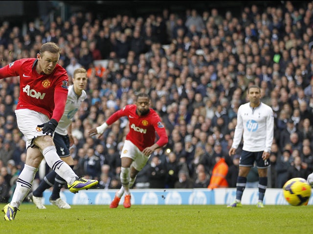 Manchester United's English striker Wayne Rooney scores his second goal from the penalty spot during the English Premier League football match between Tottenham Hotspur and Manchester United at White Hart Lane in London, on December 1, 2013