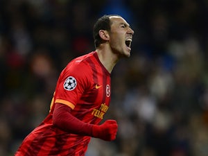 Galatasaray's Umut Bulut celebrates after scoring his team's opening goal against Real Madrid during their Champions League group match on November 27, 2013