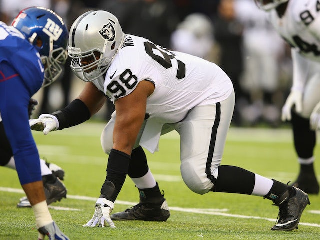 Vance Walker of the Oakland Raiders in action against the New York Giants during their game at MetLife Stadium on November 10, 2013