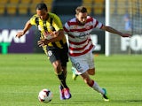 Paul Ifill of the Phoenix and Dean Heffernan of the Wanderers compete for the ball during the round eight A-League match between the Wellington Phoenix and the Western Sydney Wanderers at Westpac Stadium on December 1, 2013