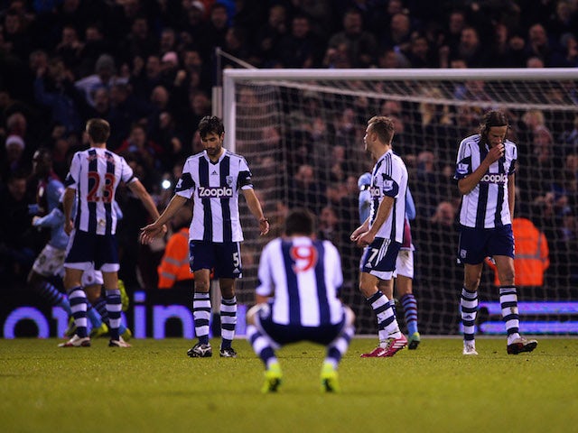Despair for Claudio Yacob, Shane Long, James Morrison and Jonas Olsson of West Bromwich Albion as Ashley Westwood of Aston Villa scores on November 25, 2013