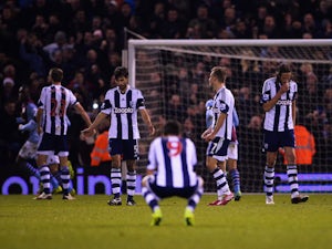 Despair for Claudio Yacob, Shane Long, James Morrison and Jonas Olsson of West Bromwich Albion as Ashley Westwood of Aston Villa scores on November 25, 2013