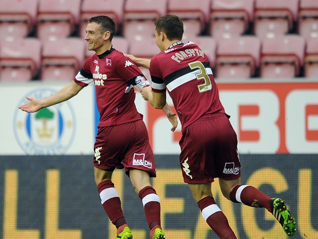 Craig Bryson of Derby County celebrates scoring the opening goal with team-mate Craig Forsyth during the Sky Bet Championship match between Wigan Athletic and Derby County at DW Stadium on December 01, 2013