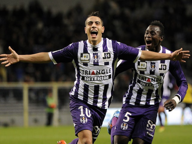Toulouse's French forward Wissam Ben Yedder celebrates after scoring a goal during a French L1 football match between Toulouse and Sochaux on November 30, 2013