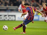 Barcelona's Spanish midfielder Xavi scores a penalty during the UEFA Champions League group H football match against Ajax on November 26, 2013