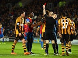 Yannick Bolasie of Crystal Palace is shown the red card by referee Anthony Taylor during the Barclays Premier League match between Hull City and Crystal Palace at KC Stadium on November 23, 2013