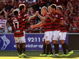 Western Sydney's Aaron Mooy celebrates with teammates after scoring the equaliser against Melbourne Heart during their A-League match on December 7, 2013