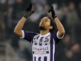 Toulouse's Abel Aguila celebrates after scoring his team's opening goal against Montpellier during their Ligue 1 match on December 8, 2013