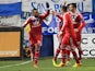 Lyon's Alexandre Lacazette celebrates with teammates after scoring his team's opening goal against Bastia during their Ligue 1 match on December 8, 2013