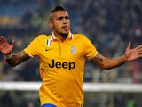 Juventus' Arturo Vidal celebrates after scoring the opening goal against Bologna during their Serie A match on December 6, 2013