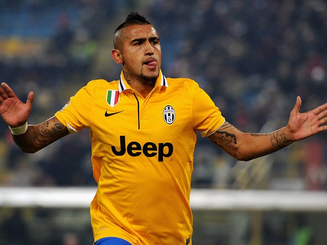 Juventus' Arturo Vidal celebrates after scoring the opening goal against Bologna during their Serie A match on December 6, 2013